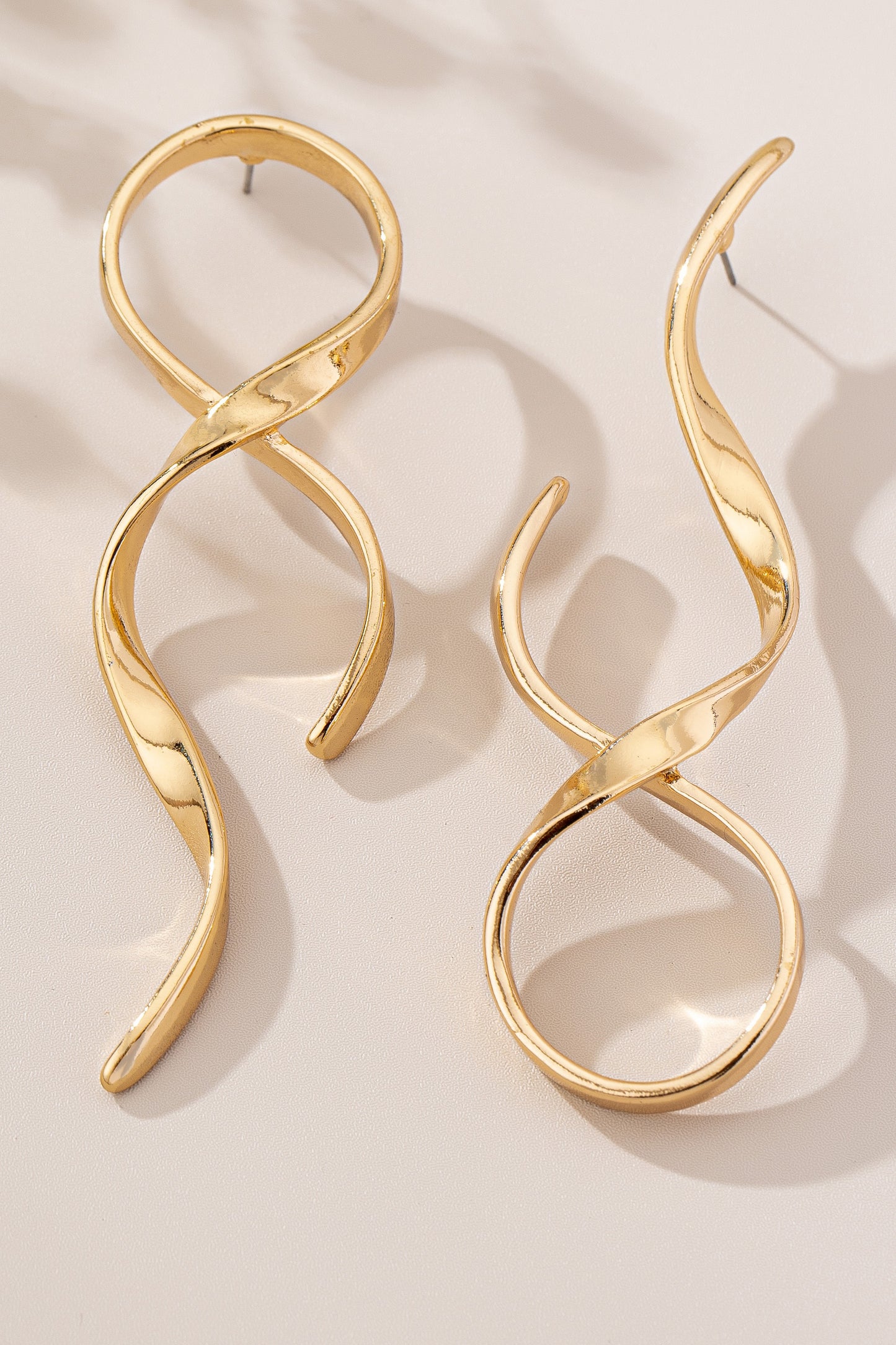 Asymmetric twisted metal ribbon earrings